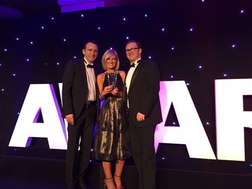 Directors at the SME Manufacturer Awards holding trophy